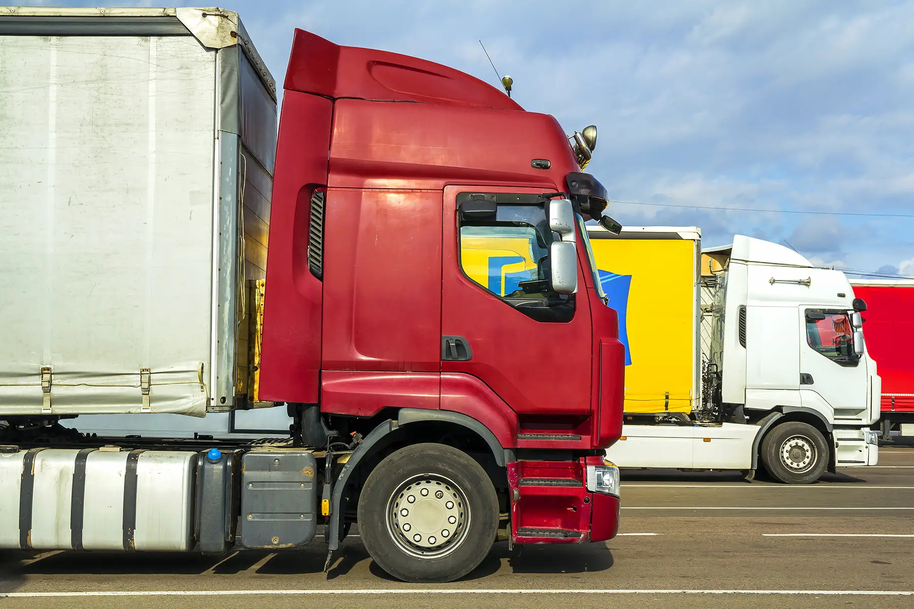 Logistics trucks parked in a fleet yard